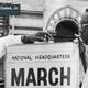 Bayard Rustin (left) speaking to administrative chairman Cleveland Robinson (right) (Wikimedia Commons)